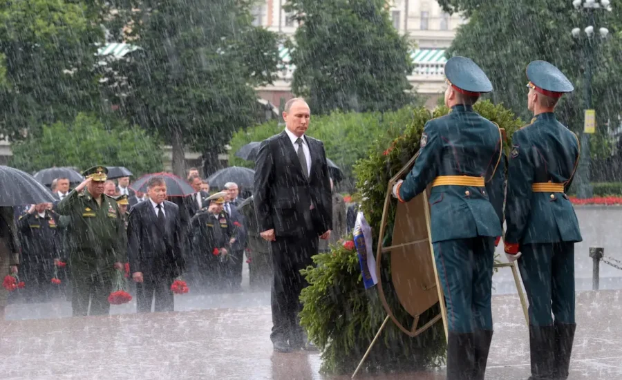 Russian President Vladimir Putin stands in the rain at the Kremlin wall in Moscow, Russia on June 22, 2017, during a wreath-laying ceremony marking the anniversary of the Nazi German invasion in 1941.